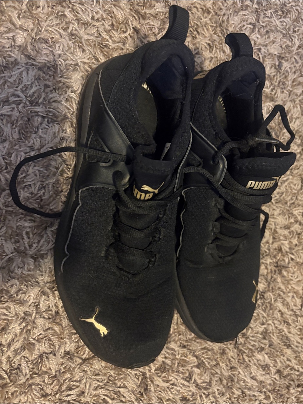 Puma Black Sneakers with Gold Puma Logos